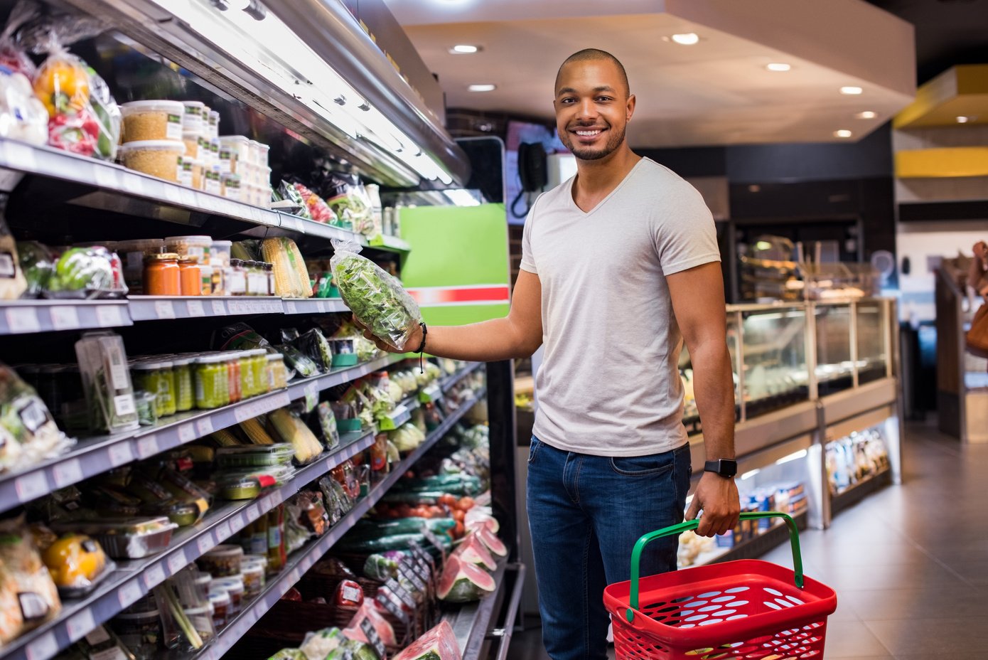 Man Buying Vegetables at a Supermarket